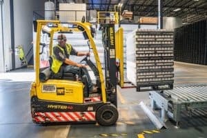 forklift reversing in storage area